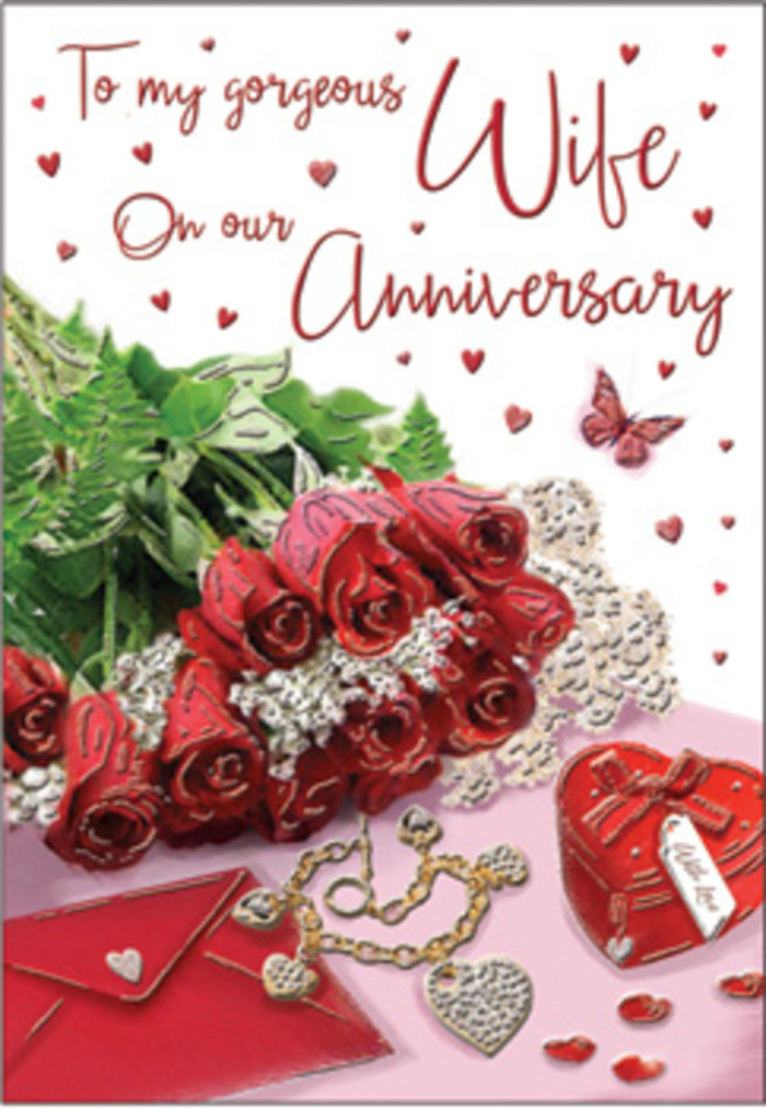 A rich, romantic tableau unfolds in this anniversary card design, as if arranged on a quiet afternoon in Archway after a visit to the local florist. At centre stage is a hand-tied bouquet of classic red roses, each bloom rounded and luxuriously full, showcasing intricate layers of petals that deepen from ruby at the core to softer crimson at the edges. The roses are wrapped and cradled by fresh green foliage, adding a sense of abundance and natural elegance reminiscent of the greenery around nearby Dartmouth Park. Around this floral focal point, delicate lace-like textures and heart motifs are scattered, catching the light in soft reflections that echo the shimmer of treasured keepsakes. To one side, a jewellery set rests elegantly, its polished surfaces and subtle sparkle suggesting an anniversary gift chosen with care-perhaps a surprise following a romantic dinner in Archway. A vivid red box, smooth and inviting, hints at what memories it might hold: rings, letters, or small tokens accumulated over shared years. The entire composition is suffused with warmth, from the gentle cream and ivory tones of the background to the velvety reds and quiet metallic glints of gold. It feels like a visual embrace, where every object is placed with intention, mirroring the thoughtfulness that goes into celebrating a long-lasting relationship. This card captures not just the beauty of roses, but the textures of a life built together-velvet, silk, paper, and metal woven into one harmonious scene, perfect for honouring an anniversary in Archway with style and deep affection.
