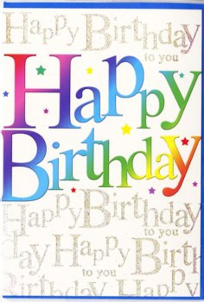The birthday card in the image radiates pure happiness, almost like a bouquet translated into ink and paper. Dominating the front is the greeting Happy Birthday, spelled out in tall, cheerful letters that flow through a lush gradient of colour. The transition is seamless: rich red at one side blends into pink, then moves through velvety purples, clear sky blues, and jade greens before glowing into warm yellows and light orange at the other end. Each character is fully saturated, with soft edges that suggest the gentle blending you see when a florist arranges multi-coloured blooms in one generous hand-tied bunch. Behind this main message, a background layer of fine golden script repeats the words Happy Birthday to you, written in an elegant cursive that curls and loops like ribbons on a beautifully wrapped present. The metallic ink has a light-catching quality, giving the impression of a subtle shimmer rather than heavy glitter, reminiscent of late-afternoon sun along Archway Road when everything seems to glow. The card stock looks thick and smooth, possibly with a satin finish that would feel sleek beneath your fingertips, hinting at good quality without losing warmth. Tiny, scattered decorative elements in matching rainbow shades float around the letters, like playful dots of confetti frozen mid-air. The overall composition feels balanced and joyful, with enough white space to keep the design from feeling crowded. It's the sort of birthday card you might choose at Flower Delivery Archway to accompany a bright, mixed arrangement going out to a celebration in Archway or nearby Tufnell Park, offering both visual excitement and a genuinely heartfelt sentiment.